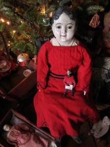 This large papier-mache boy was a present from my husband several Christmases ago.  He is wearing a "new" dress for Christmas that I just bought for him from Edyth O'Neill. It arrived today and I couldn't wait to try it on him.  