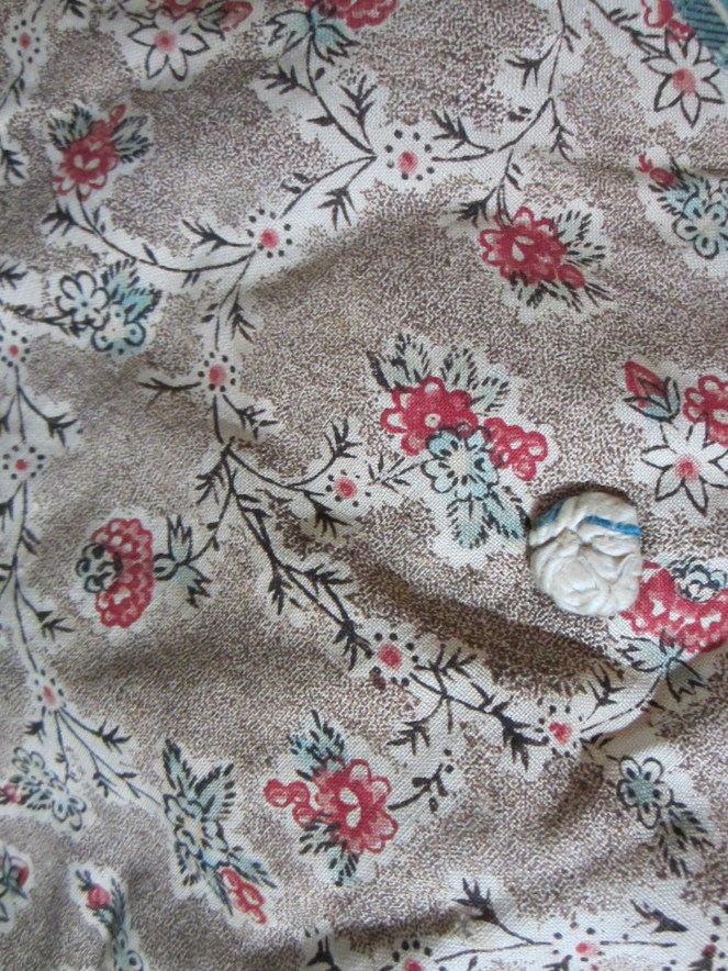 I was thrilled to find part of a very early tied quilt.  This practically pristine 18th century chintz is going into my Queen Anne doll making supply stash.