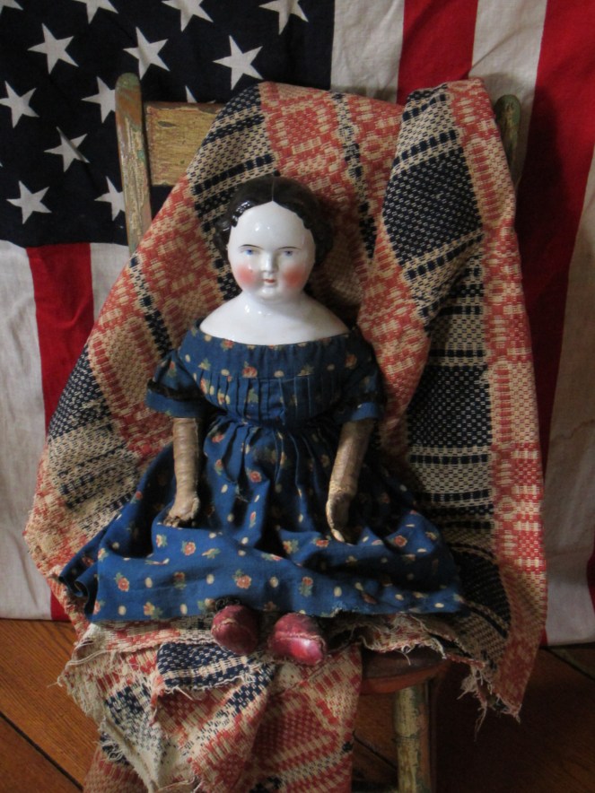 I bought this doll last week when I visited Rainie Crawford.  Rainie purchased the doll from the original owners family in New Briton , CT.  The doll has lovely child like proportions, a spectacular wool challis print dress and very sweet little red leather shoes.  She has promised to share all of her dressmaking secretes with my Izannahs! 