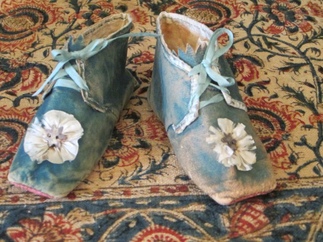 These glorious Prussian blue leather baby shoes were another purchase from Rainie.  They are very simply the BEST shoes I have ever seen in my life!  I am particularly drawn to them because of their resemblance to the shoes I make for my Izannahs.  I plan to study their construction for insights on how to improve my 19th century shoe making skills. 