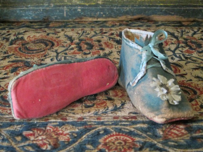 Surprise! Rosy red leather soles!!!  I can just picture these shoes on tiny waving baby feet...
