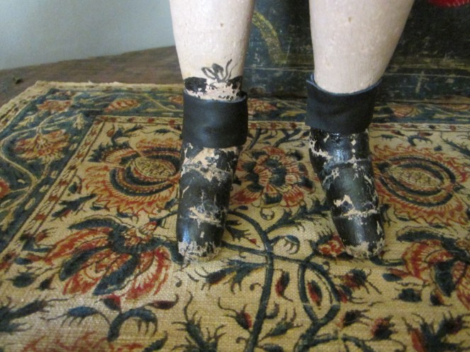 A close-up of the painted boots on an original Izannah Walker doll.  Compare them with the child's boot in the following photo.