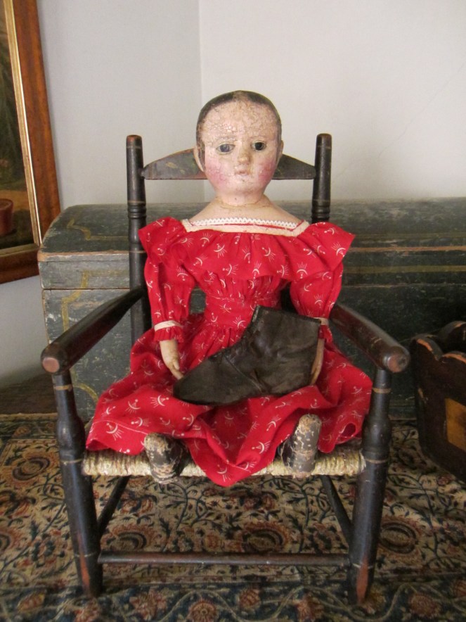 My antique Izannah Walker holding an antique child's lace up boot.