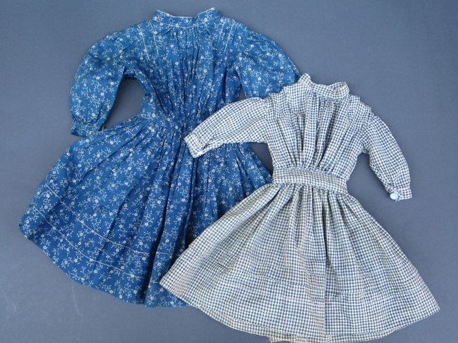 Evelyne sent me a photograph of an antique Izannah Walker wearing a dress that was made in a very similar way to the indigo print dress on the left.  I bought the antique  indigo dress last September with the intention of using to draft a pattern.  Evelyne's request for a blue check dress motivated me to finally get a pattern drawn up.