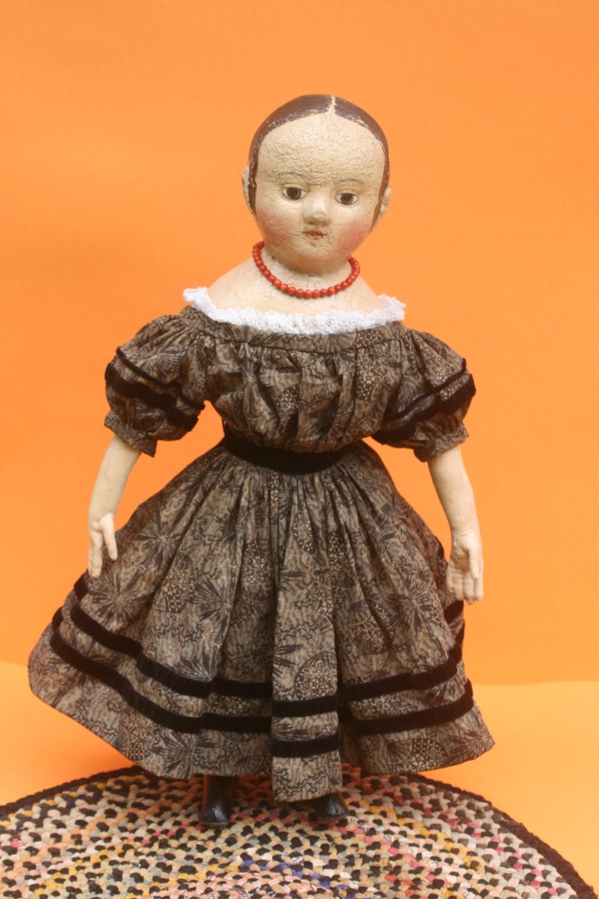 Isabeau #2 in her black party frock. The dress fabric dates to the late 1800's. Rows of antique black velvet ribbon encircle the sleeves, waist and hem of the dress.