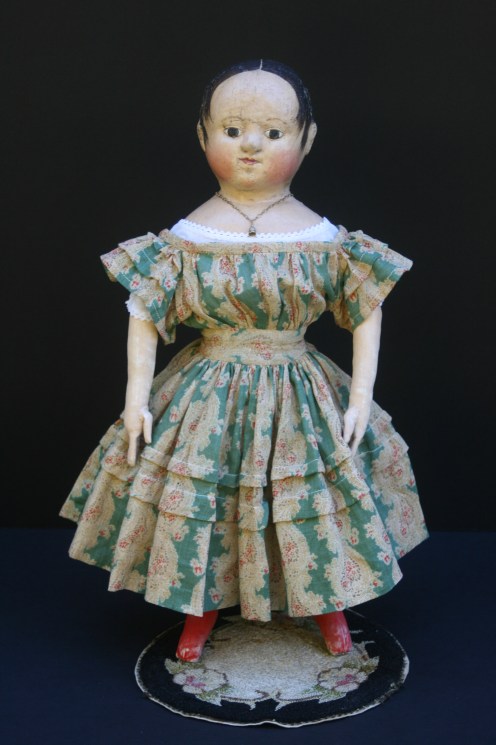 Anna #2 is shown here wearing her dress made from a very early c. 1830-1840 cotton gauze paisley print.  The green, red, brown and ivory fabric is perfect for late fall and the upcoming Christmas season.  The sleeves and skirt of the dress have graduated growth tucks.