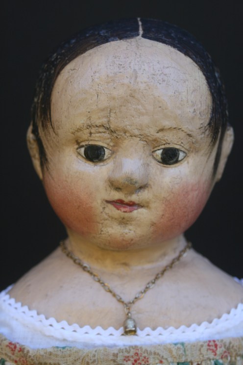 Anna#2 wears a tiny golden thimble on a chain around her neck.