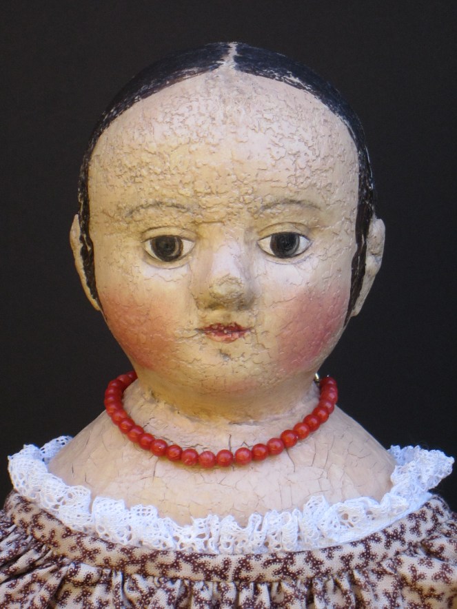 Isabeau #2 shows off her hand strung real coral beads.