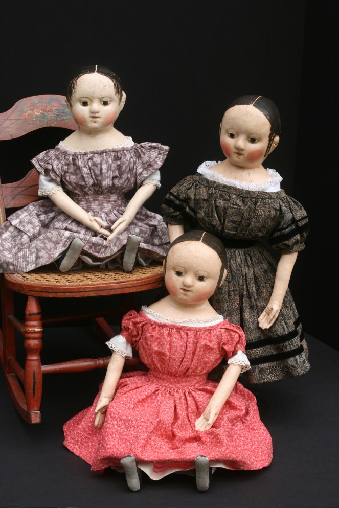 A family portrait... The doll in the pink dress has been sold.