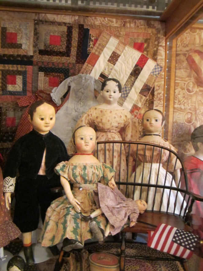 It was really nice to be able to see two of the dolls I've made again (the one in the green and red dress sitting on the bench and the one in the apron standing behind the bench).  On the left hand side of the picture is a boy doll made by Jan Conwell and the tallest doll in the back is one of Edyth's antique papier-mache dolls.