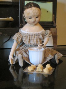 The older dolls decided that Izzybelle couldn't get into too much trouble if they let her sprinkle the sugar on top of the cookies...  After all it couldn't be any messier than what Izzybelle really wanted to do, which was make rows and rows of mud pies for the party!
