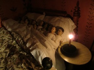 Since Isabeau is one of the oldest dolls, she plays "Mother" and tucks in all of the rest.