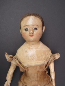 My mission was to remove multiple layers of paint to get back down to the original paint on this doll and to remark her very battered replacement arms.