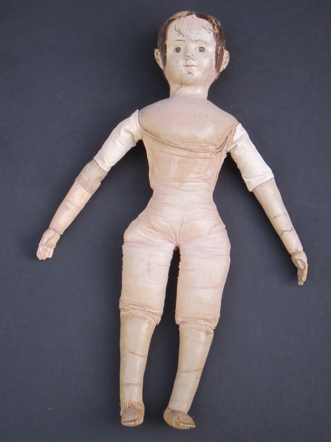 Another look at the color restoration of the face and shoulders. The change in color is very subtle. These photos were taken before the doll was seen by her owner. After the owner had a chance to see the replaced arm and replaced antique linen upper arm covering, we decided to "age" the fabric and arm more.