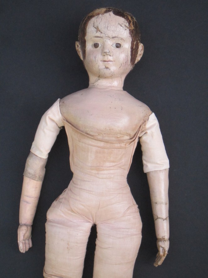 A third after restoration photo.  The change in color is very subtle. These photos were taken before the doll was seen by her owner. After the owner had a chance to see the replaced arm and replaced antique linen upper arm covering, we decided to "age" the fabric and arm more.