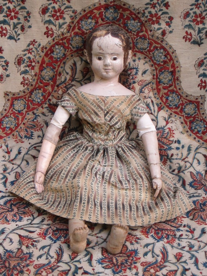 A 2nd after restoration photo.  The change in color is very subtle. These photos were taken before the doll was seen by her owner. After the owner had a chance to see the replaced arm and replaced antique linen upper arm covering, we decided to "age" the fabric and arm more.