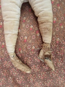 Her ankles are still fragile, but all of their stuffing is in place and they are more firmly attached.