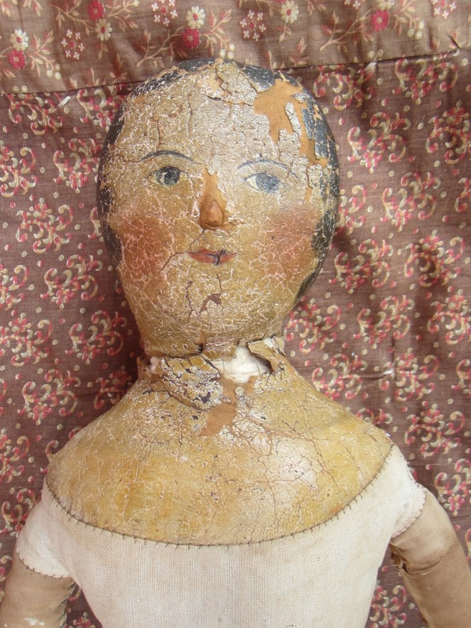 This is the doll after minor repair to her neck.  