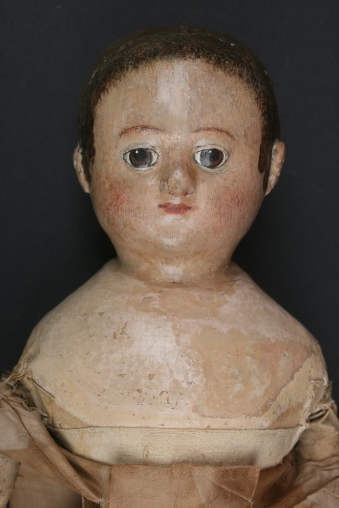 A sweet 18 inch Izannah with multiply layers of repaint.