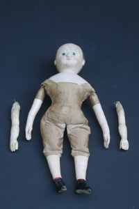 After restoration.  The old replacement arms are being preserved as part of the doll's history.