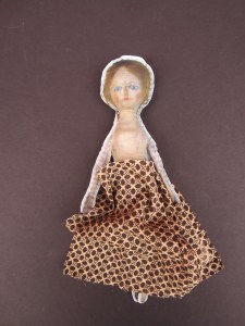 Tiny scraps of antique fabric can be fashioned into clothing for your tiny dolls.
