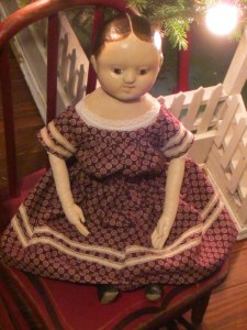 I finished her last dress late at night, so she posed under my Christmas lights.  Bright and early the next morning she was off on her journey to her brand new home just in time for Christmas!