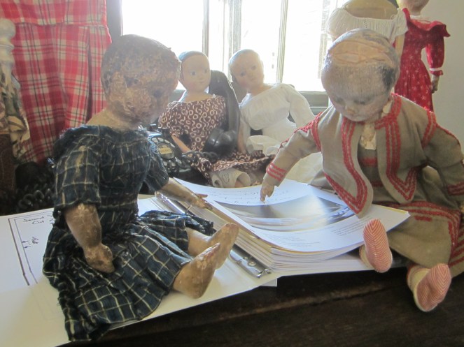 "Izzybelle, make sure you have the holes lined up with the rings."  "I will Ismay. Do you think someone in the class will make a doll that looks like me?"