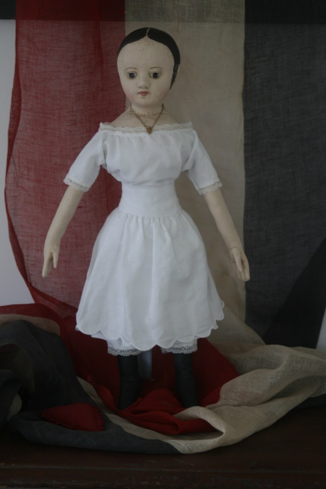 A scalloped hem petticoat is the last layer of her undergarments and echos the theme of her scallop lace trimmed chemise and pantalettes and her scallop topped boots. 