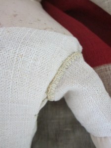 A fortunate find was this antique linen with a crochet edge, which makes the perfect finish to the top of her arm coverings.