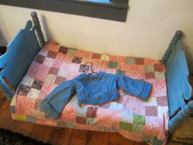 And what should little brother wear to the party? A blue linen jacket trimmed with black braid and brass buttons!