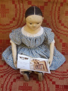 Learning about her new family... "So this is what Hitty looks like!"